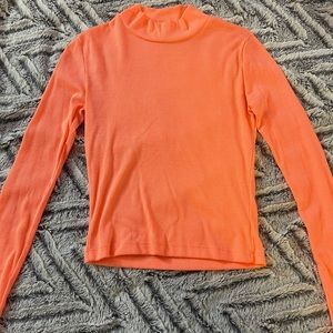 Long sleeve orange cropped turtle neck shirt